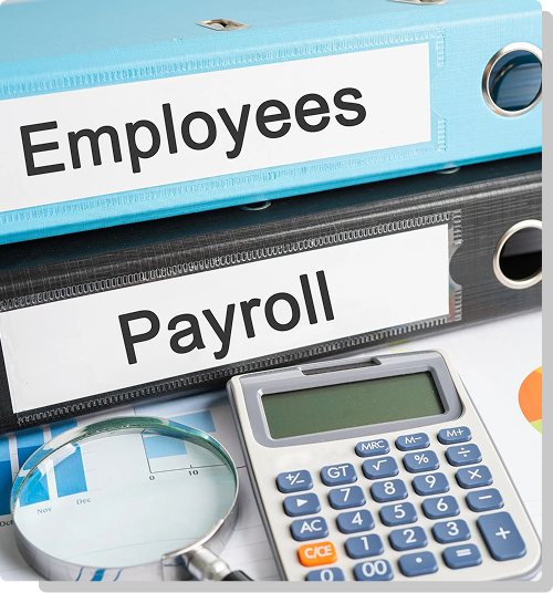Hand holding a wooden block that reads payroll