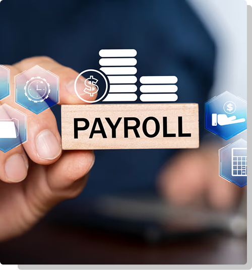 Hand holding a wooden block that reads payroll