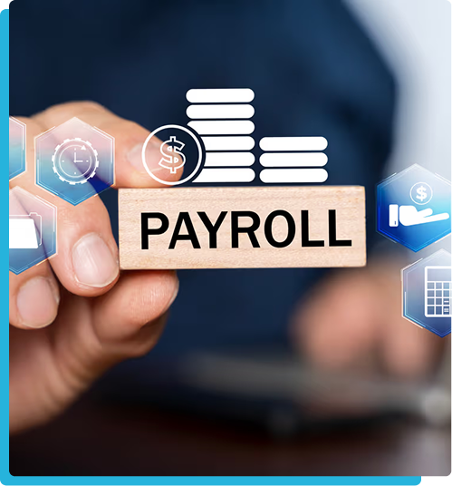 Hand holding a wooden block that reads payroll